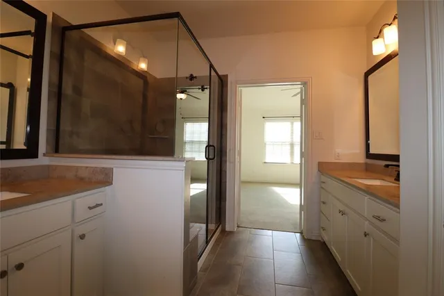 a bathroom with a sink and mirror