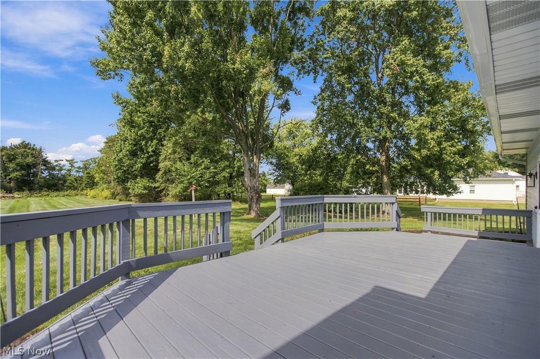 5972 Keller Road Akron, OH 44319 - Photo 29 of 29 Expansive outdoor deck with gray wood-finish decking and perimeter railing