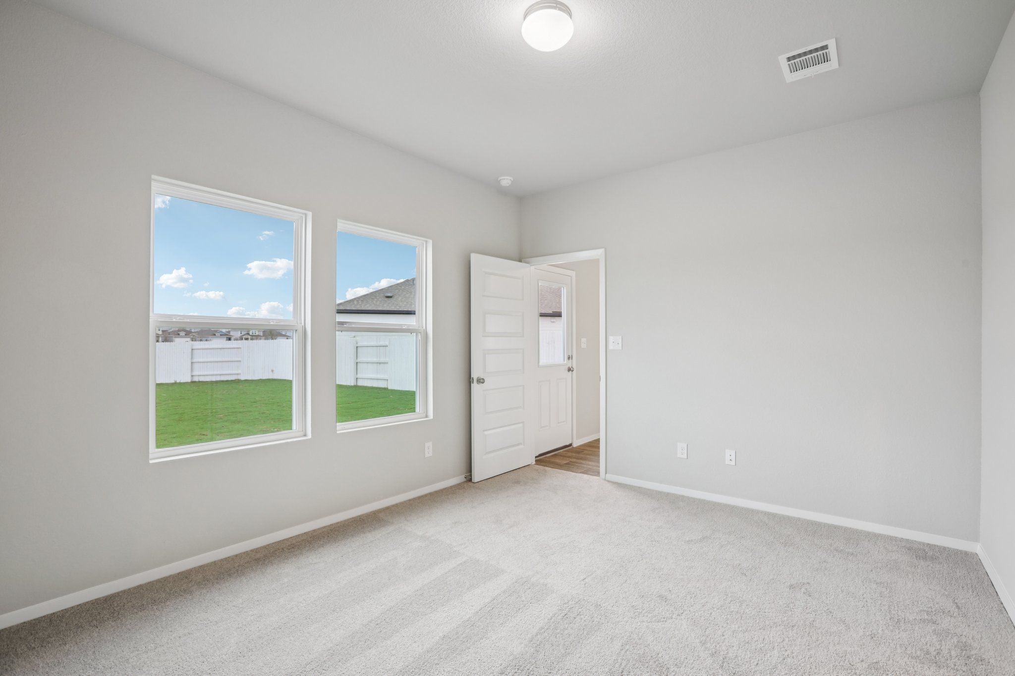 104 Summer Drive Elgin, TX 78621 - Photo 17 of 40 an empty room with windows