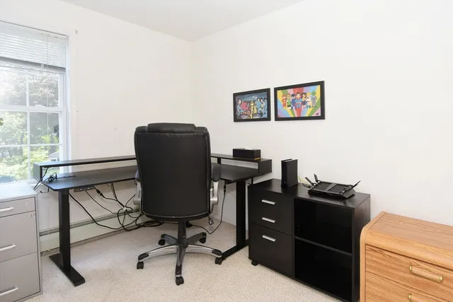 a view of a workspace with furniture