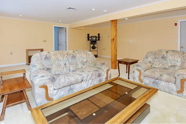 a living room with furniture and a table
