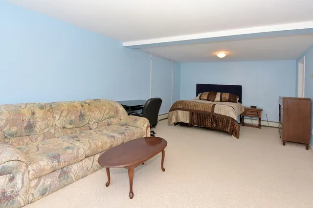 a bedroom with furniture and a couch