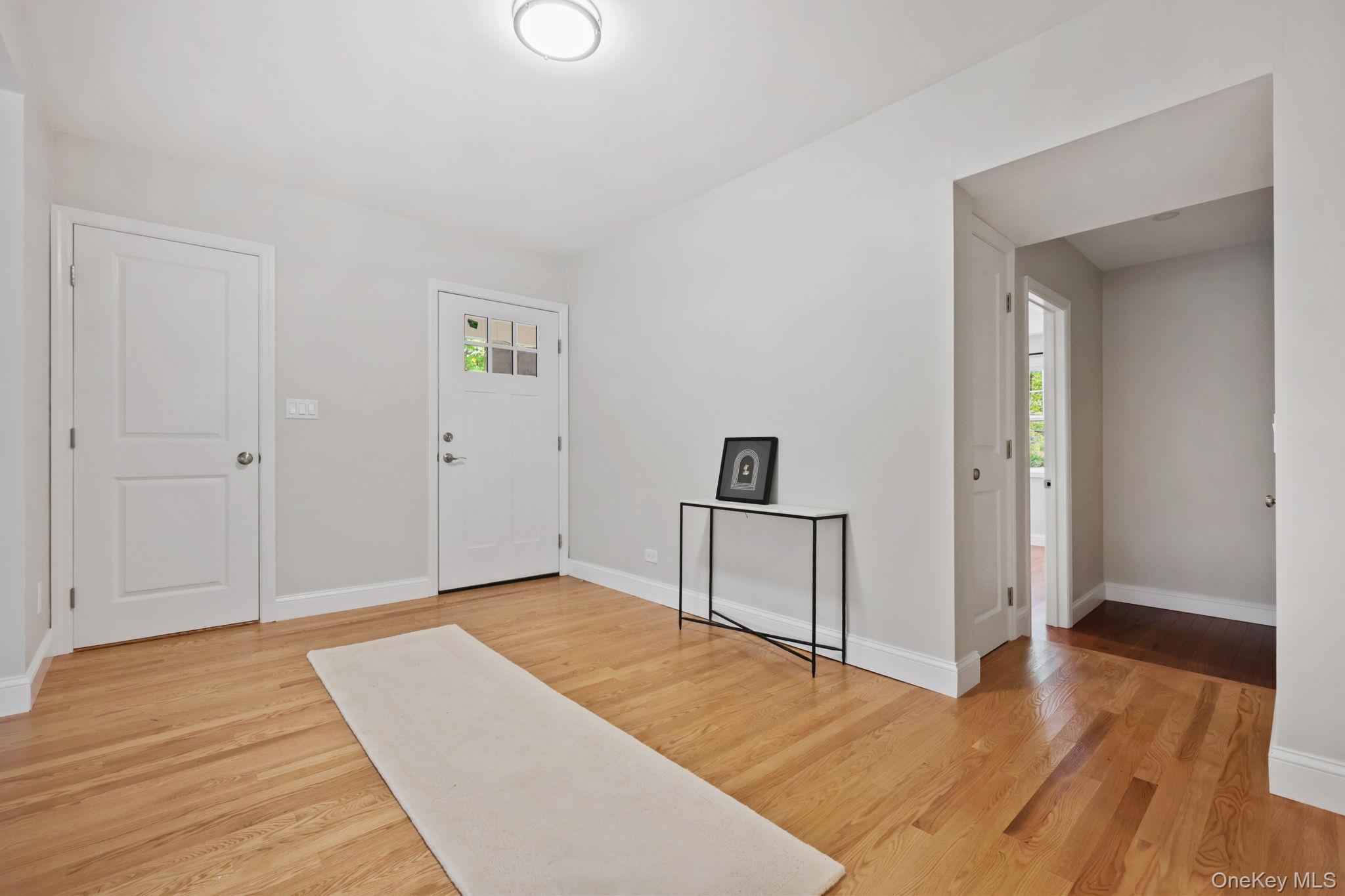 790 Hardscrabble Road Chappaqua, NY 10514 - Photo 22 of 40 Entryway featuring light wood-type flooring and baseboards