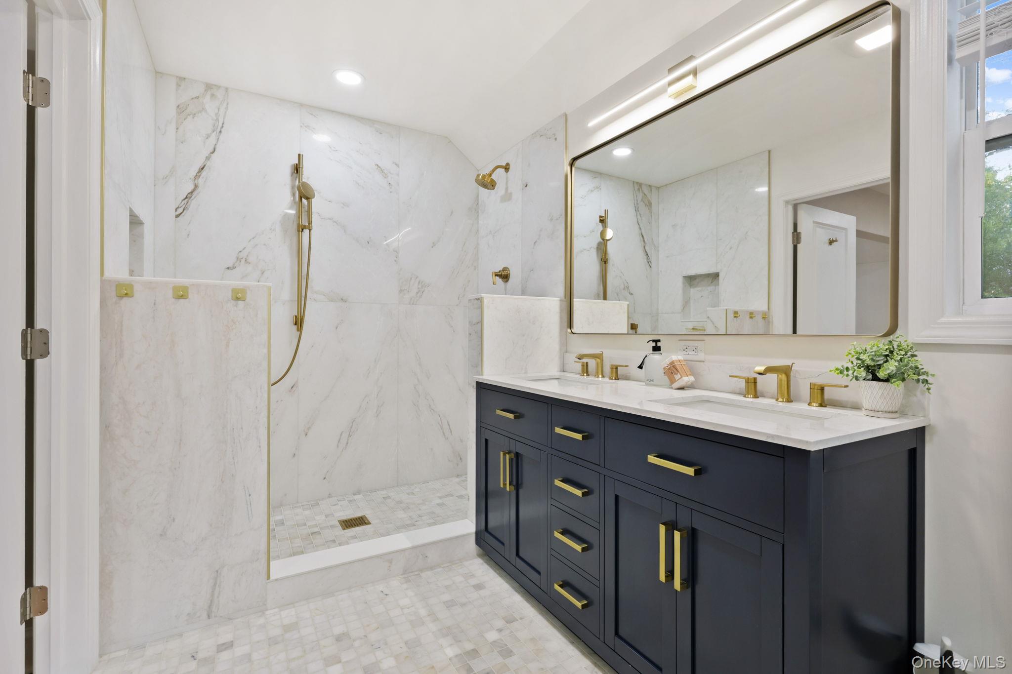 790 Hardscrabble Road Chappaqua, NY 10514 - Photo 30 of 40 Full bathroom featuring double vanity, a marble finish shower, recessed lighting, and tile walls
