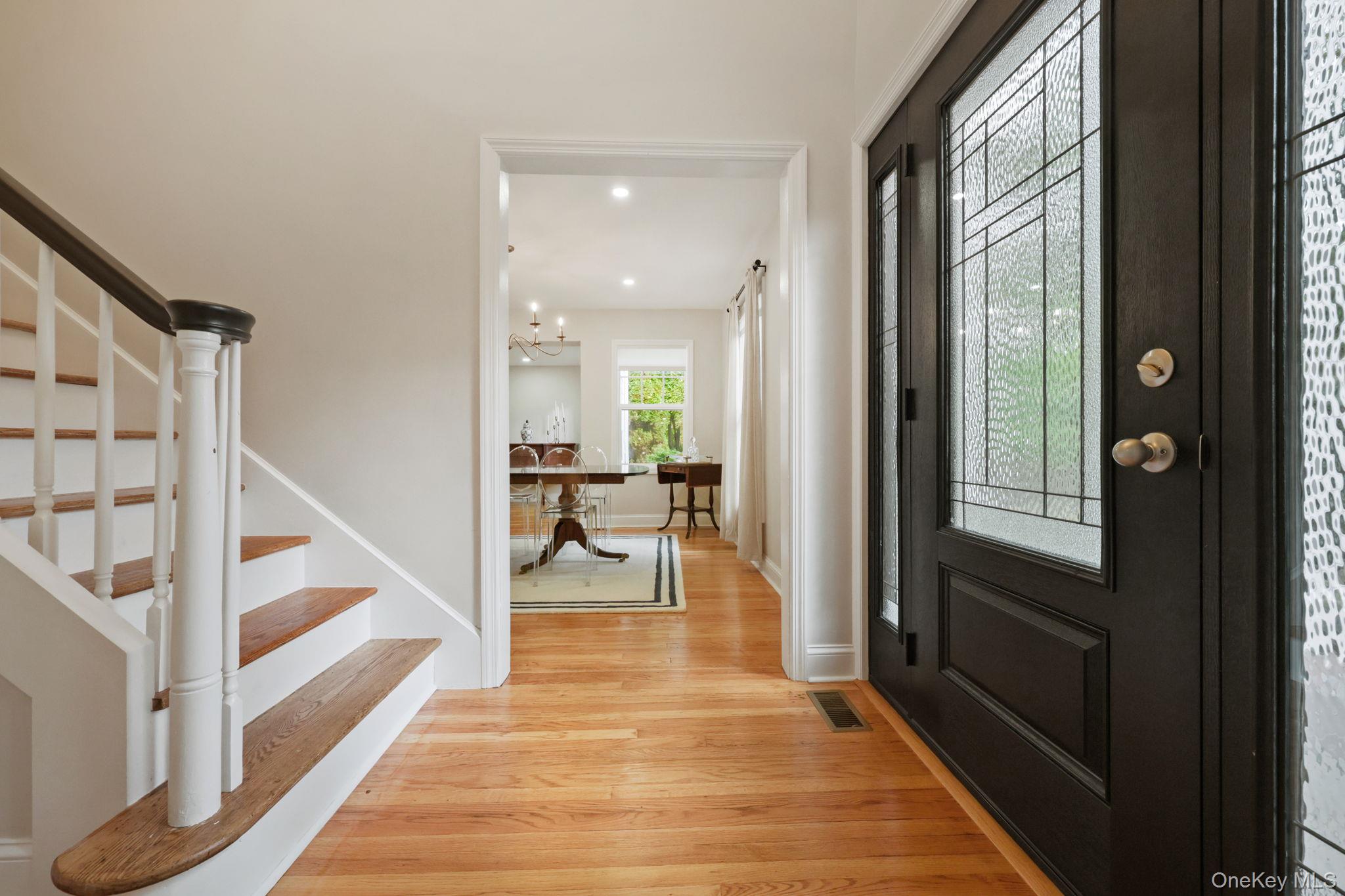 790 Hardscrabble Road Chappaqua, NY 10514 - Photo 3 of 40 Foyer with stairs, light wood finished floors, a chandelier, and recessed lighting