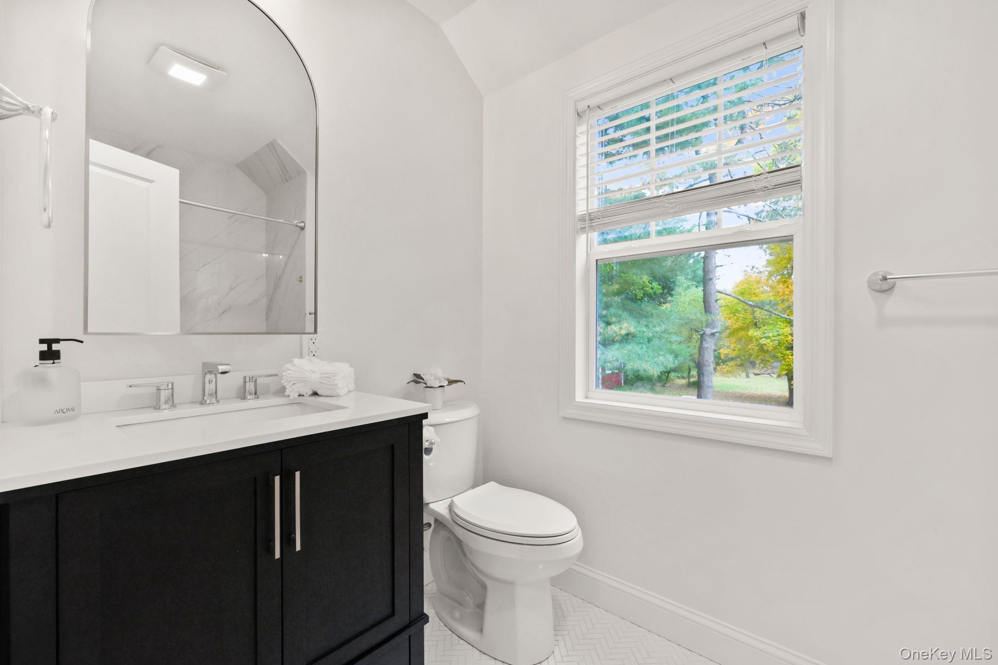 790 Hardscrabble Road Chappaqua, NY 10514 - Photo 36 of 40 Full bathroom with a marble finish shower, vanity, and lofted ceiling