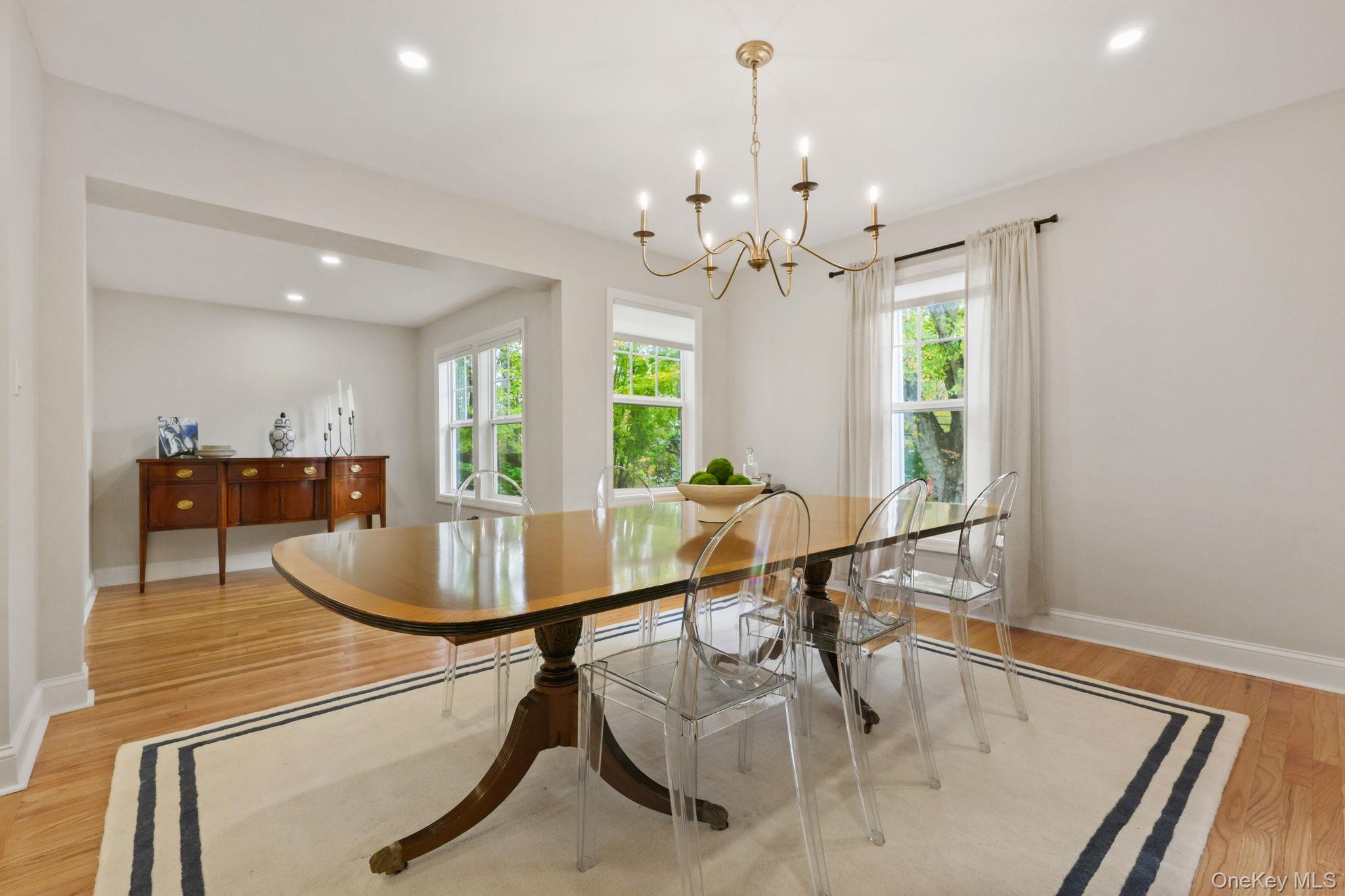 790 Hardscrabble Road Chappaqua, NY 10514 - Photo 10 of 40 Dining area featuring light wood-type flooring, recessed lighting, and a chandelier