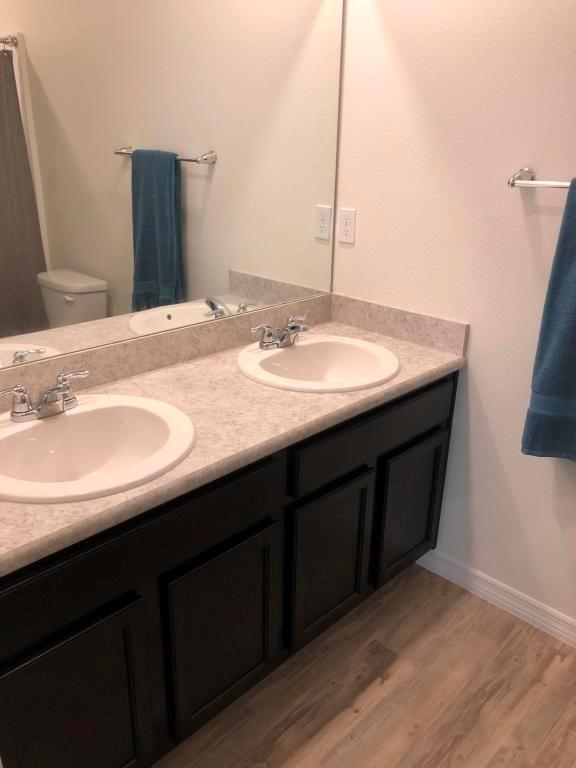 1050 Southwest McCall Road Port St. Lucie, FL 34953 - Photo 30 of 41 a bathroom with a sink and a mirror