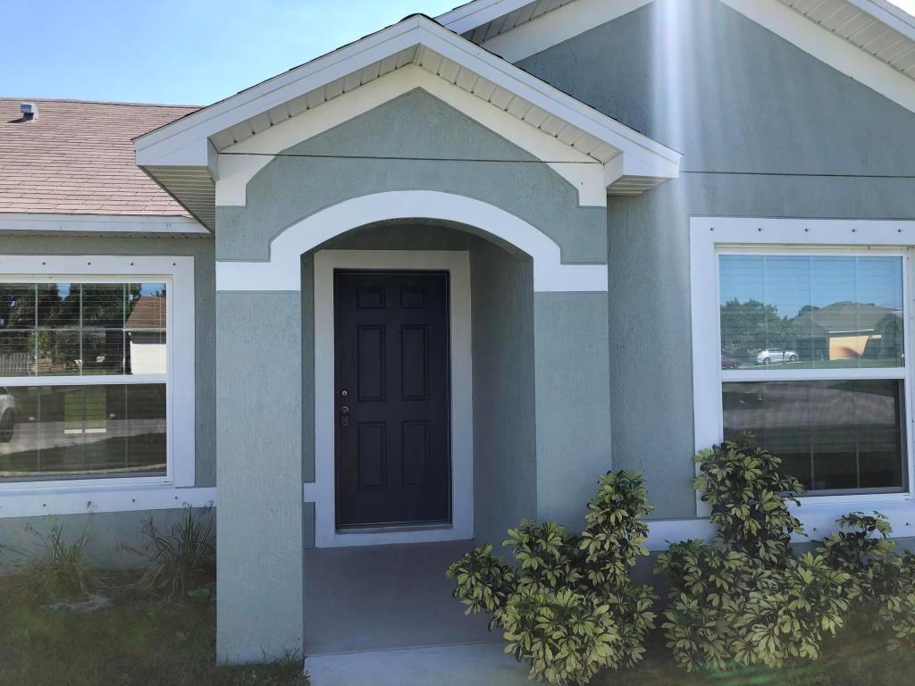 1050 Southwest McCall Road Port St. Lucie, FL 34953 - Photo 8 of 41 a front view of a house