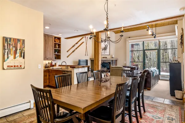 a dining room with furniture window and wooden floor