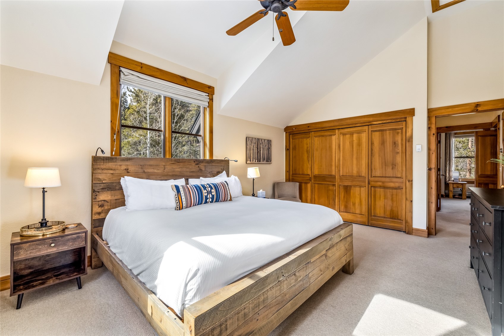 720 Alhambra Road, Unit 8741 Keystone, CO 80435 - Photo 23 of 49 a spacious bedroom with a bed and wooden floor