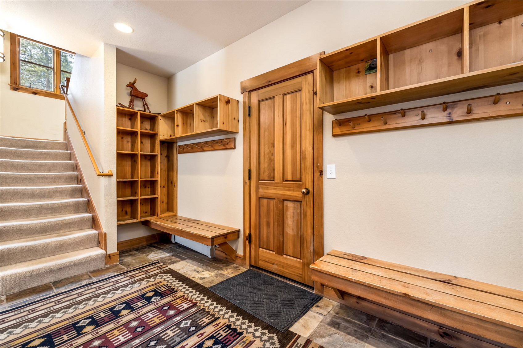 720 Alhambra Road, Unit 8741 Keystone, CO 80435 - Photo 29 of 49 a view of front door with wooden floor and a rug