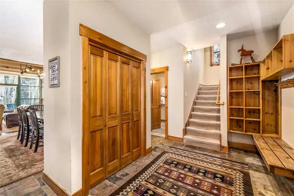 a view of a livingroom with wooden floor and furniture