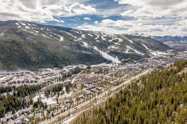 a view of outdoor space with wooden floor and trees