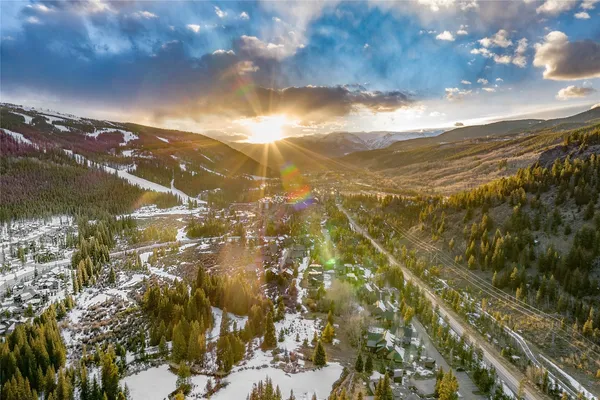 a front view of a house with outdoor seating