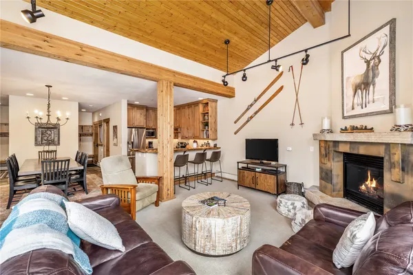 a living room with furniture fireplace and flat screen tv
