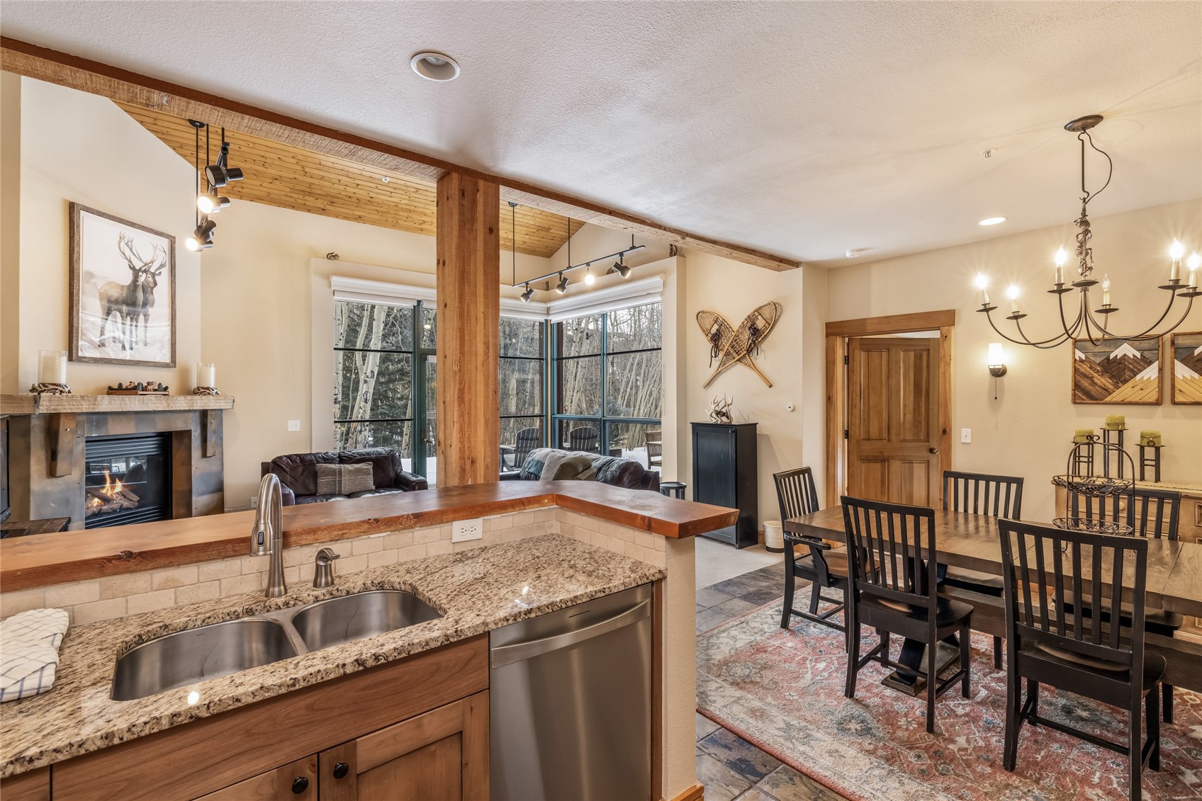 720 Alhambra Road, Unit 8741 Keystone, CO 80435 - Photo 10 of 49 a view of a kitchen with granite countertop a table and chairs