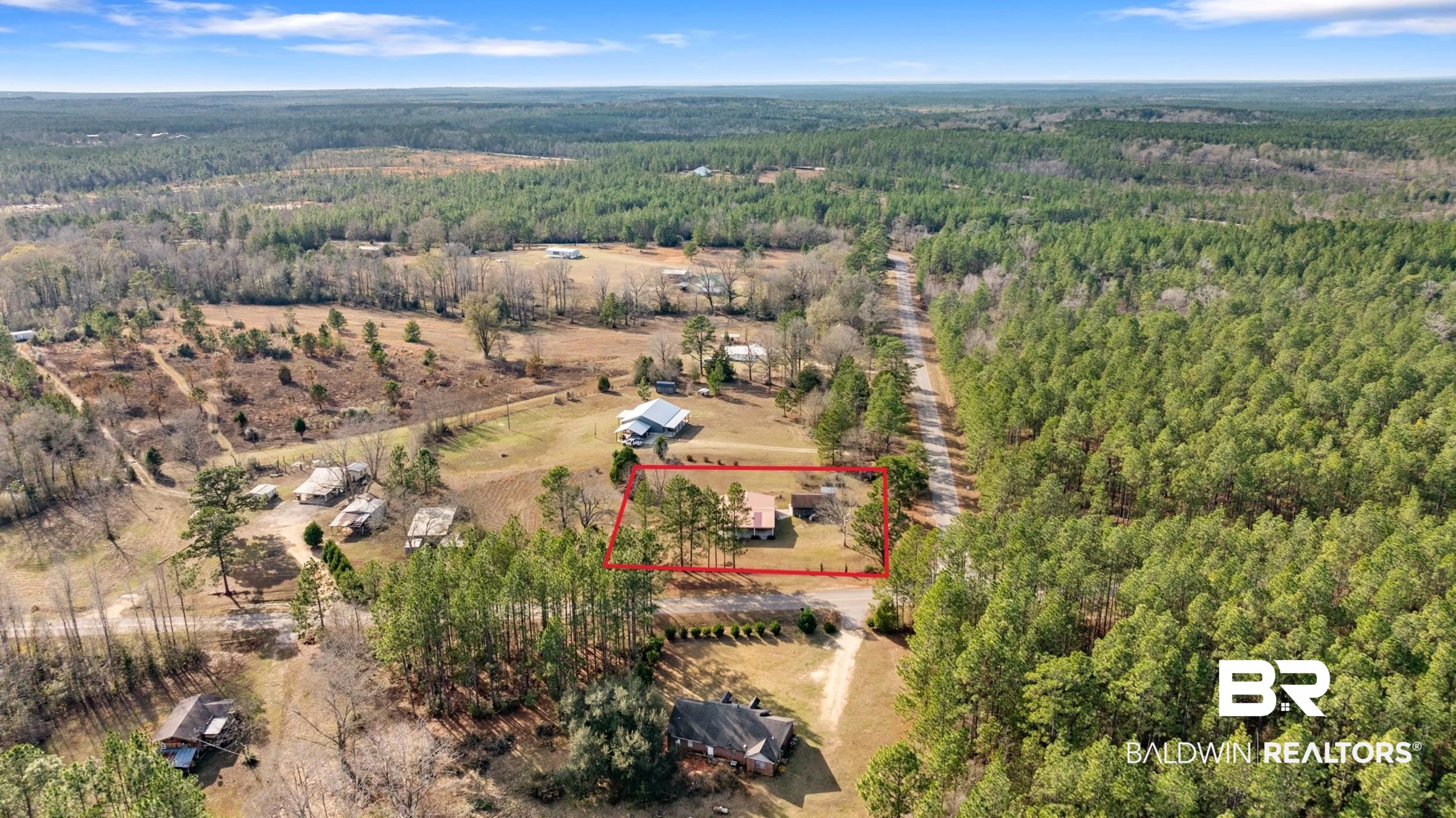 57623 Mary Hadley Road Perdido, AL 36562 - Photo 31 of 34 Aerial view of property and surrounding area with property boundaries highlighted and a forest