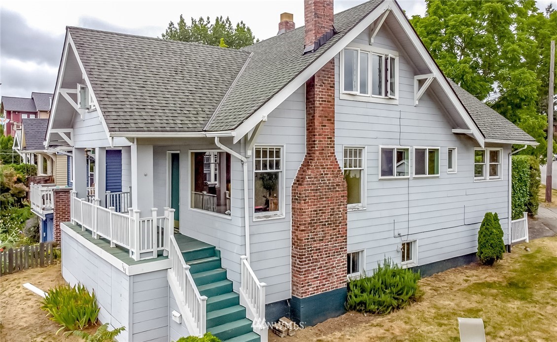 a view of a house with more windows and plants