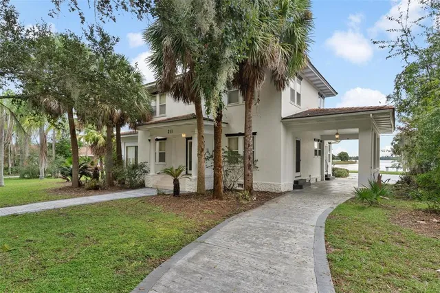 a view of a house with a yard porch and sitting area