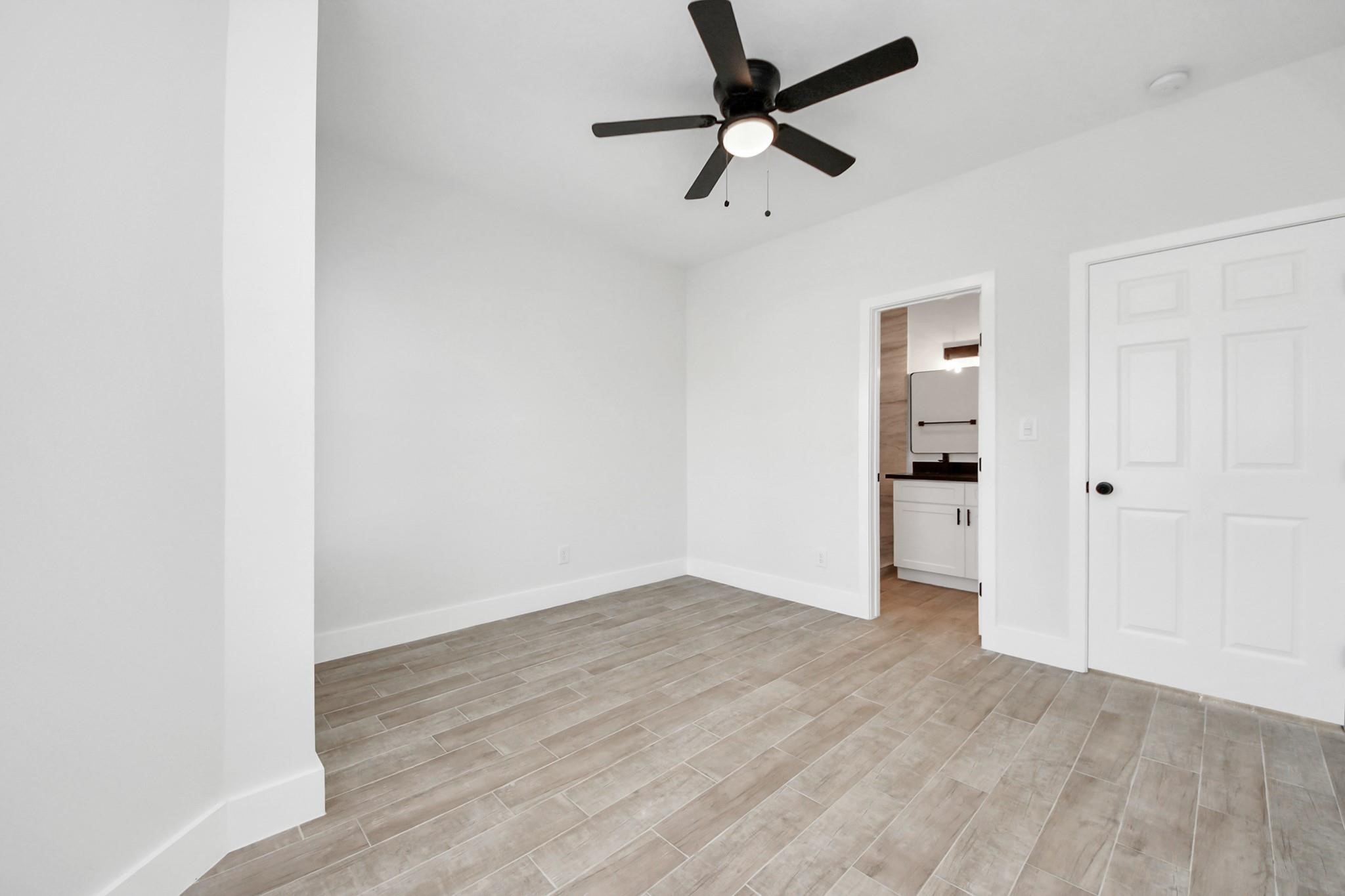 8015 Elbert Street, Unit A/B Houston, TX 77028 - Photo 8 of 12 wooden floor in an empty room