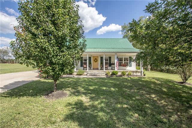 5397 Snail Shell Cave Road Rockvale, TN 37153 - Photo 1 of 19 Rocking chair front porch with a country setting.