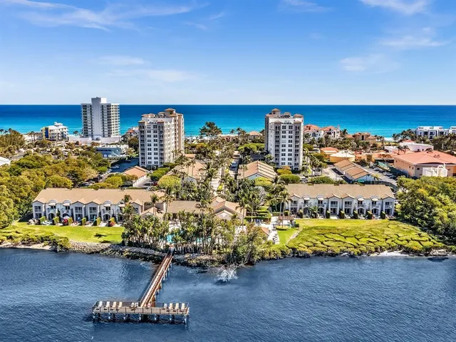 a room with gym equipment and wooden floor