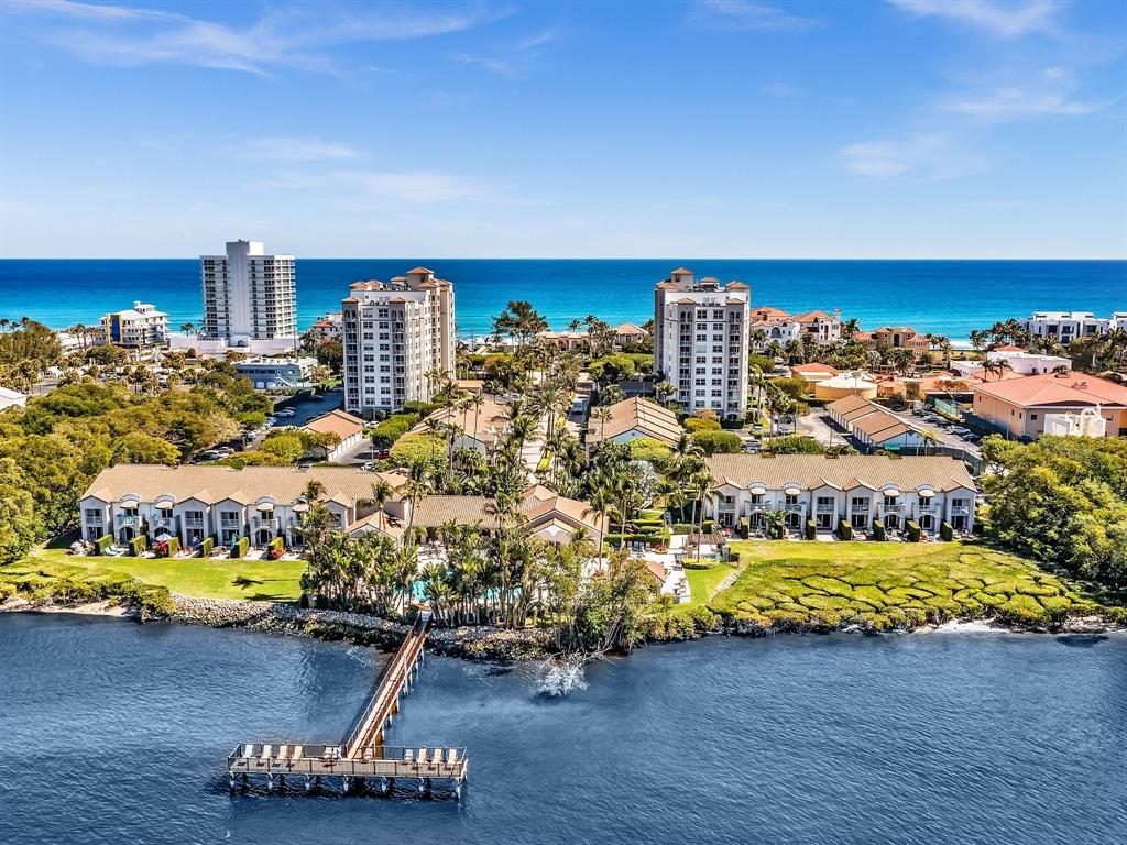 a room with gym equipment and wooden floor