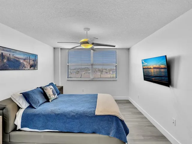 a bedroom with a bed and cupboard