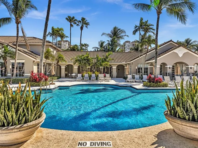 a lake view with a sitting space and a garden view