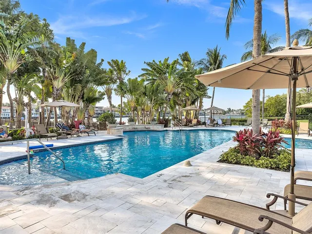 a view of swimming pool with outdoor seating