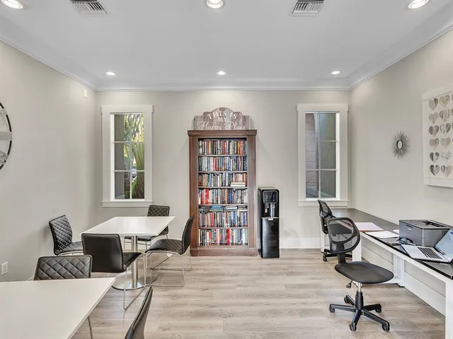 a view of a big room with windows