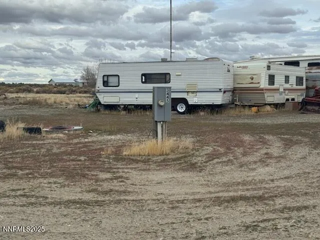 a view of a water fountain in the middle of a yard