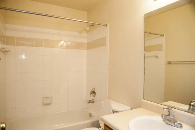 a bathroom with a bathtub and a toilet