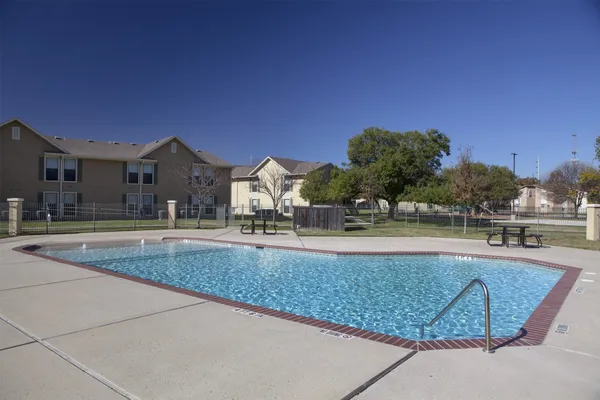 a view of a house with outdoor space and sitting area