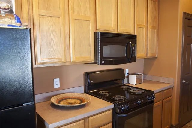 a kitchen with a stove and a microwave