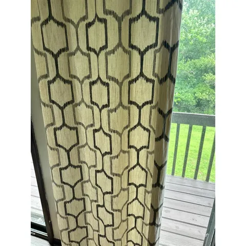 a bathroom with a shower curtain and a sink