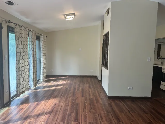 a view of entryway with wooden floor