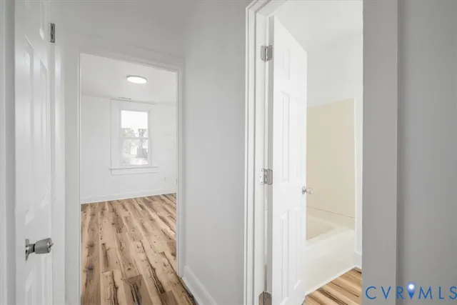 a view of bedroom with wooden floor