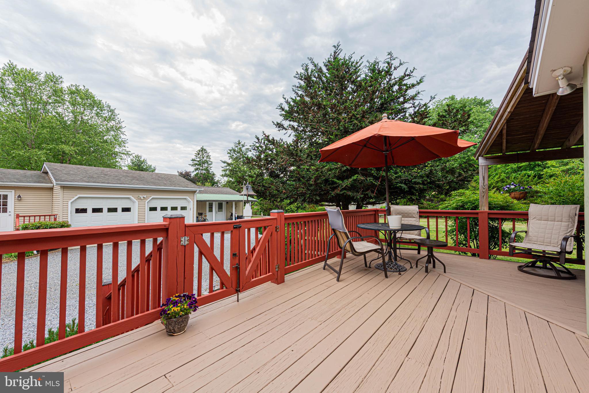 31468 Wingate Road Dagsboro, DE 19939 - Photo 14 of 48 a view of balcony with outdoor seating and wooden floor