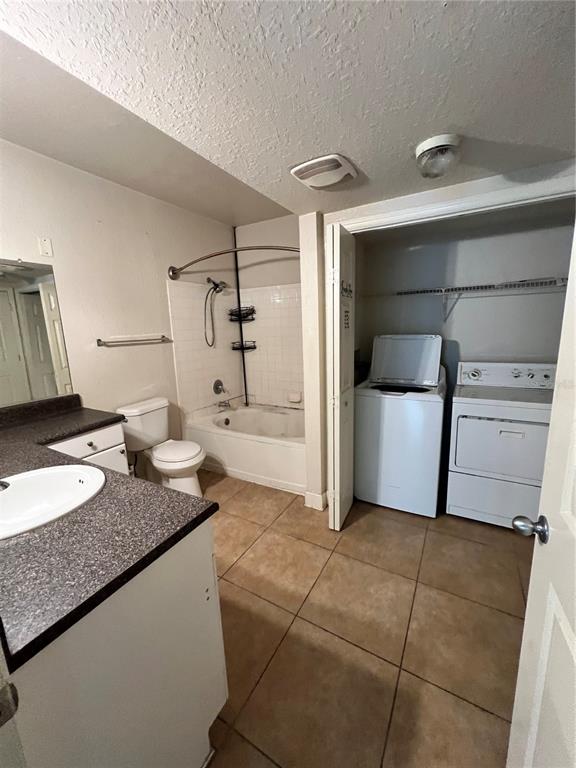 206 East South Street, Unit 2063 Orlando, FL 32801 - Photo 4 of 7 a bathroom with a granite countertop sink and a mirror