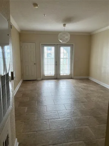 a view of an empty room with a window