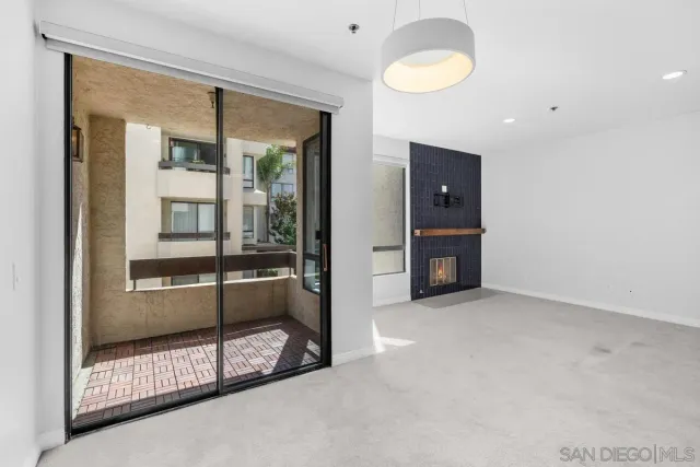 a kitchen with stainless steel appliances and white cabinets