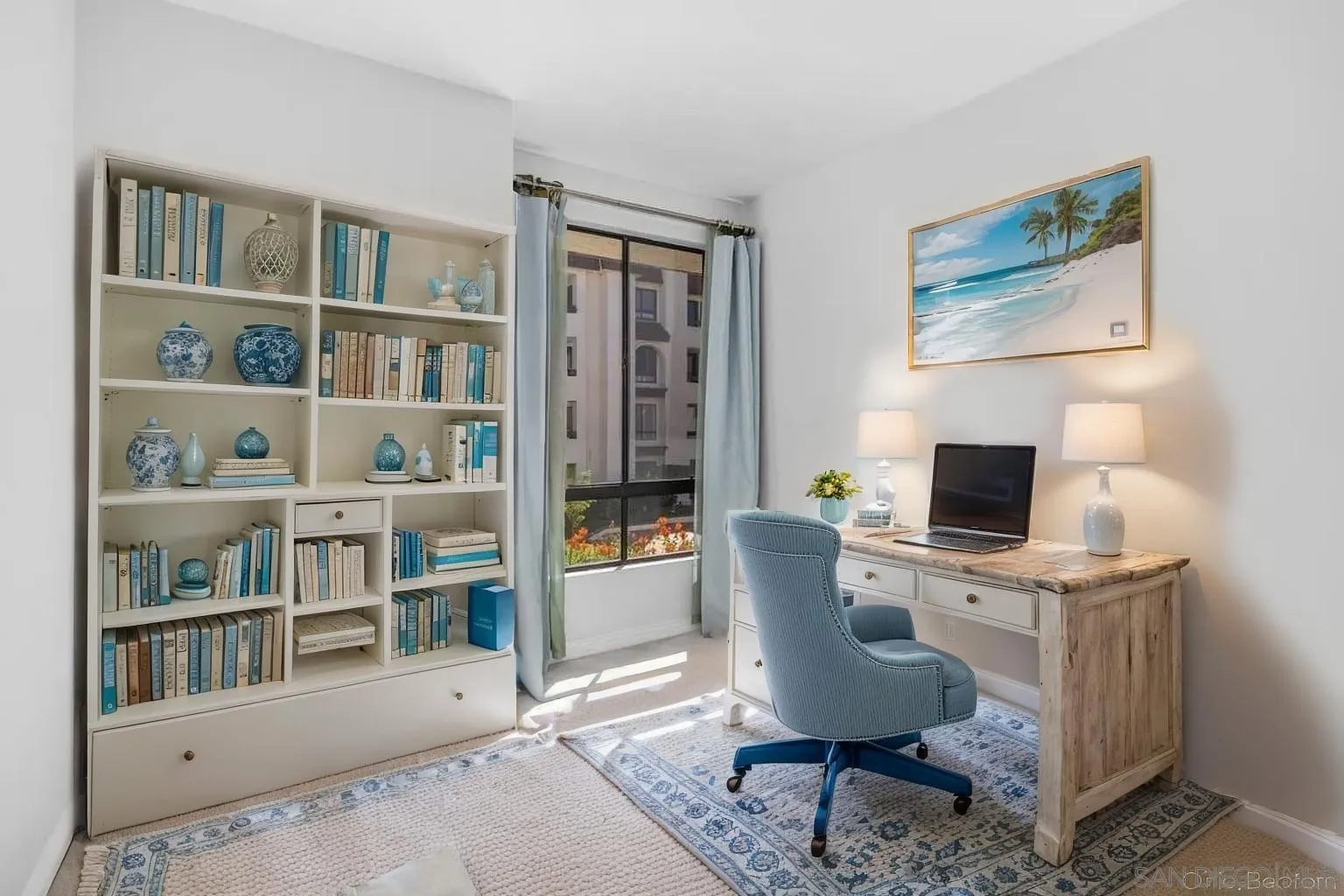 5845 Friars Road, Unit 1201 San Diego, CA 92110 - Photo 20 of 43 a view of a workspace with a bookshelf