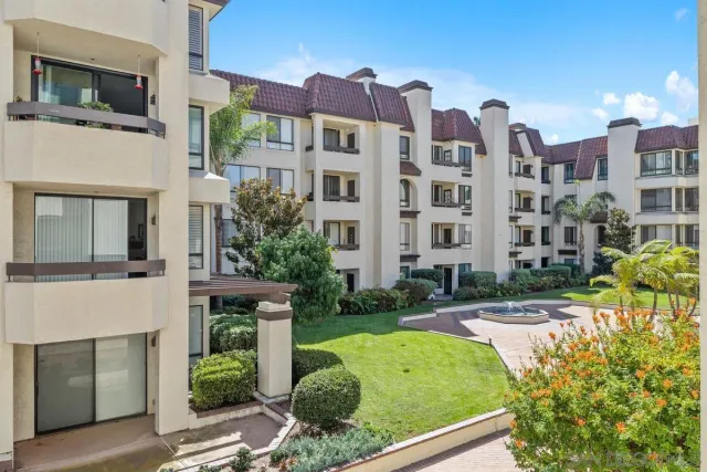 a bedroom with a large bed and a flat screen tv