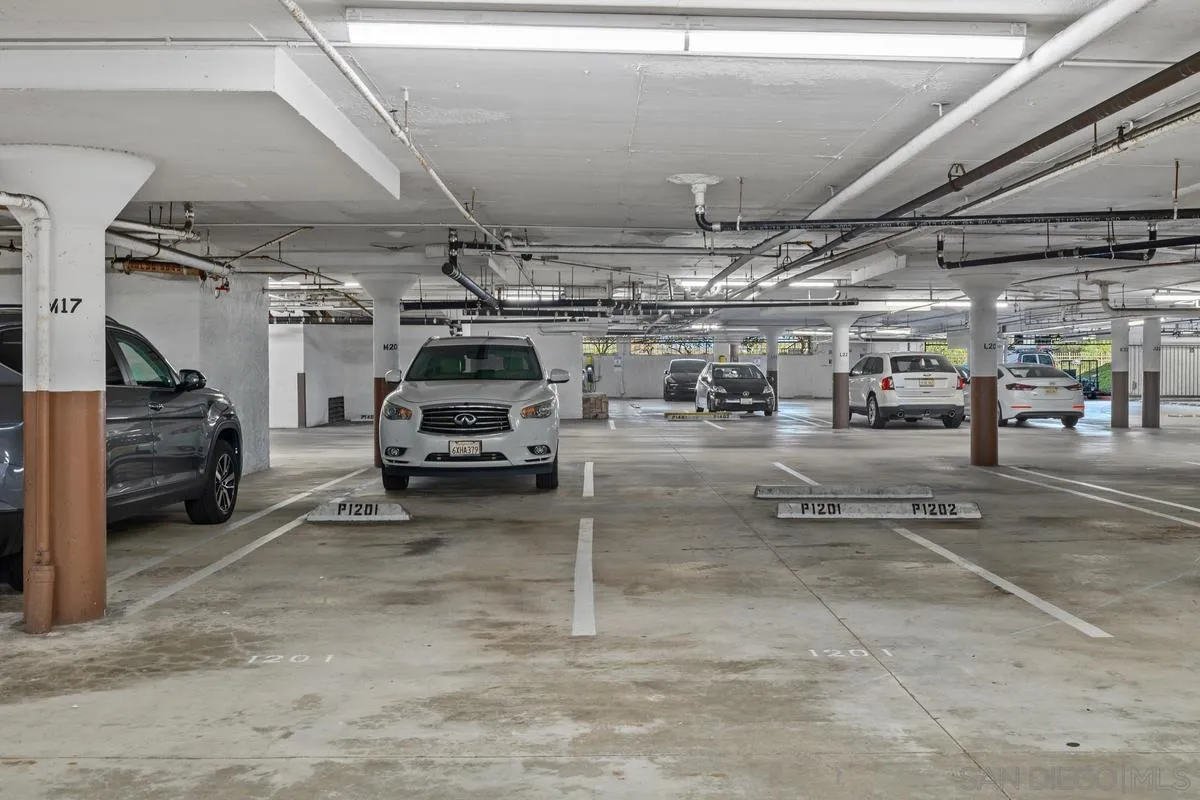 5845 Friars Road, Unit 1201 San Diego, CA 92110 - Photo 37 of 43 a view of parking garage with cars