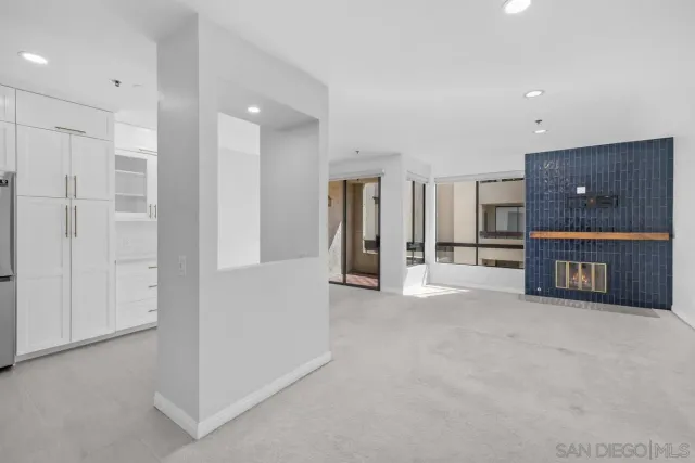 a view of a livingroom with a furniture and a bathroom