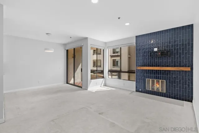 a view of an empty room with closet