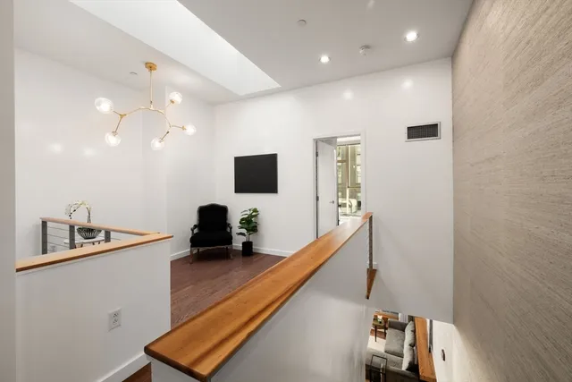 a room with furniture and a flat screen tv