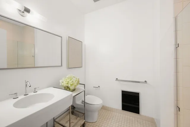 a bathroom with a sink toilet and vanity
